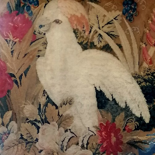 749 - 19thc gilt framed tapestry, woolwork and beadwork panel depicting a cockatoo amongst fruit and folia... 