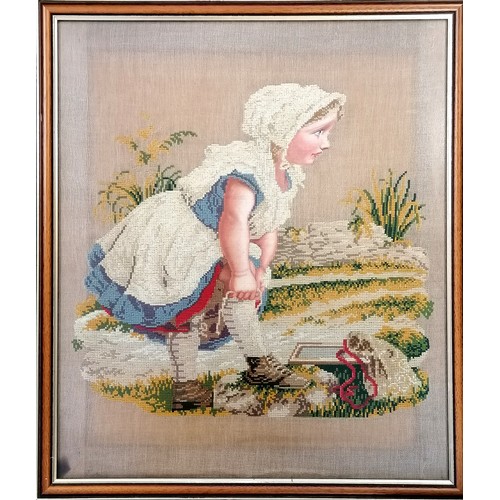 387 - An antique needlepoint in a later frame 49cm x 57cm