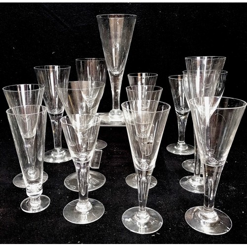 75 - 14 x champagne flutes etc - tallest 23cm some with tear stems & some with small chips