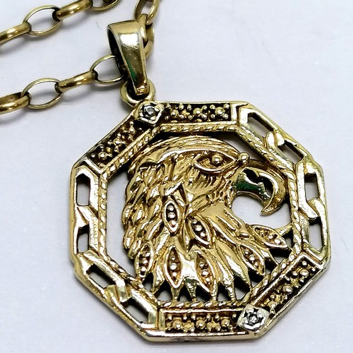 369 - Silver gilt chain (50cm) with white stone set eagle pendant in a Manchester United box