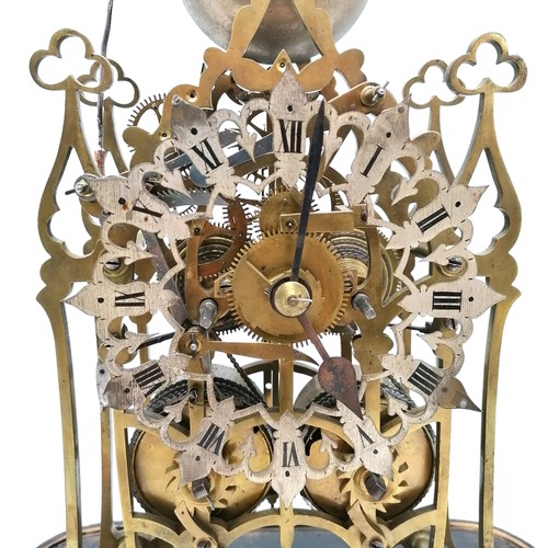 746 - Antique twin fusee brass skeleton clock with silvered dial under a dome - clock 37cm high, total hei... 