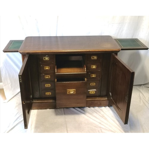 753 - Antique oak collectors / opticians cabinet with 11 drawers & cupboards to both ends (lacking handles... 