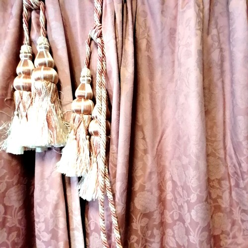 772 - Pair of pink curtains with embossed rose patttern. Each curtain 125cm wide x 217cm drop. With tie ba... 