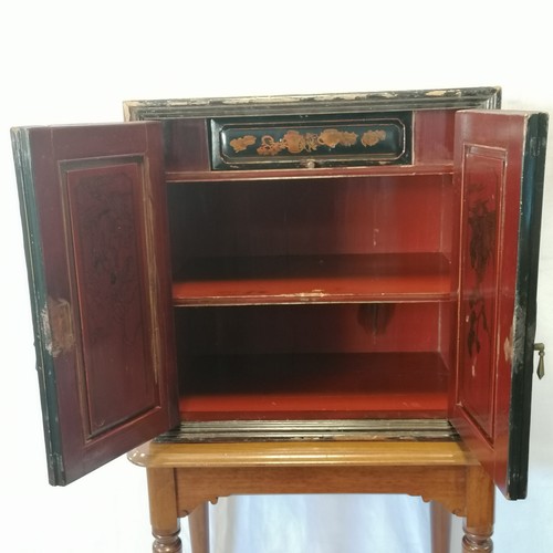 774 - Antique Chinese lacquer table cabinet with red interior, shelf and drawer. Losses and wear. 60cm wid... 