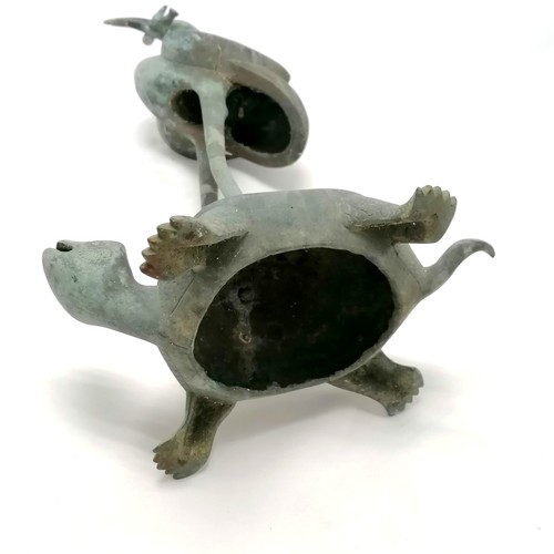 785 - Oriental Bronze figure of a flamingo riding a turtle, holding something in its beak which is broken,... 