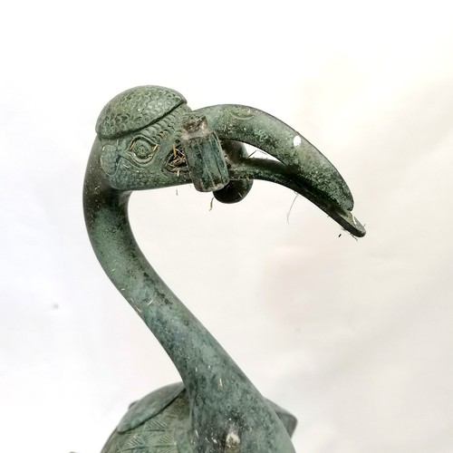 785 - Oriental Bronze figure of a flamingo riding a turtle, holding something in its beak which is broken,... 