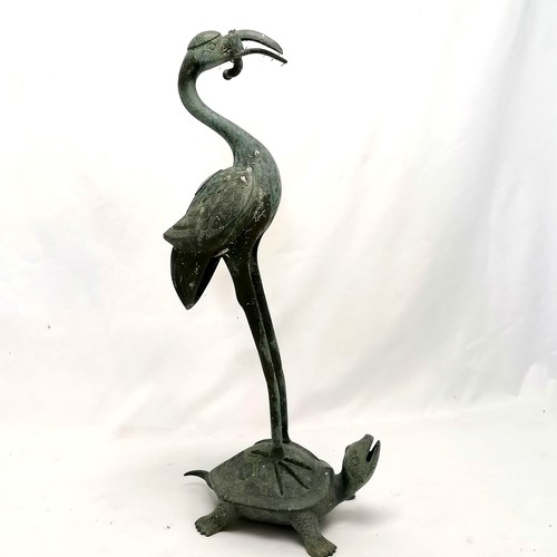 785 - Oriental Bronze figure of a flamingo riding a turtle, holding something in its beak which is broken,... 