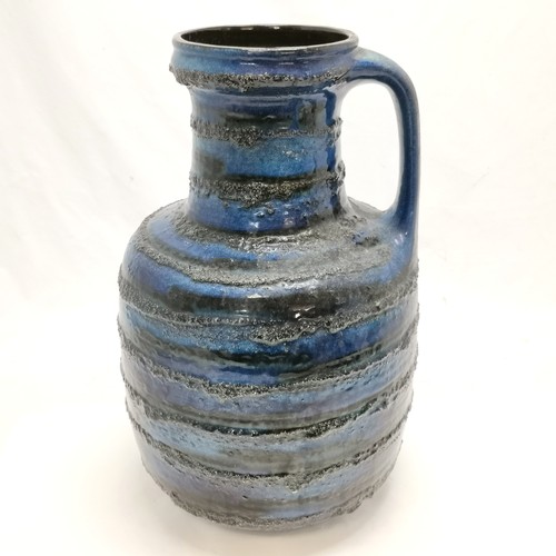 12 - Large West German pottery blue jug with lava banding #0326/40 - 42cm high & has a couple of small lo... 