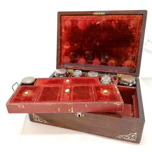 26 - Antique rosewood & mother of pearl inlaid travelling box with original fittings & plated lids to gla... 