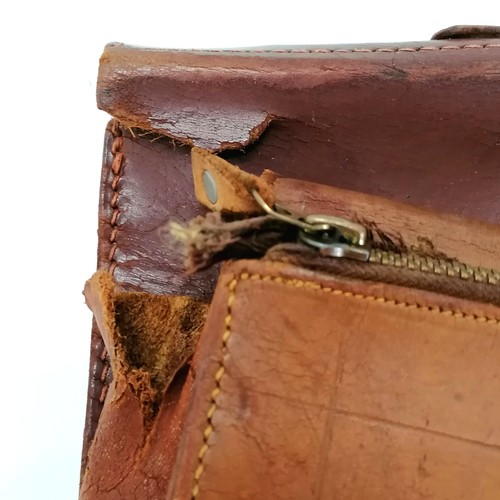 89 - 2 vintage brown leather briefcases both with damage to one corner.