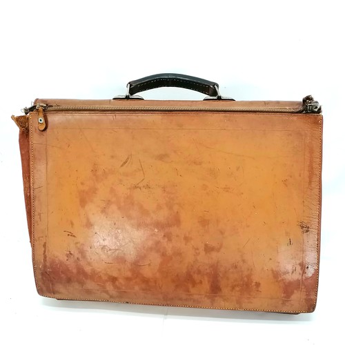 89 - 2 vintage brown leather briefcases both with damage to one corner.