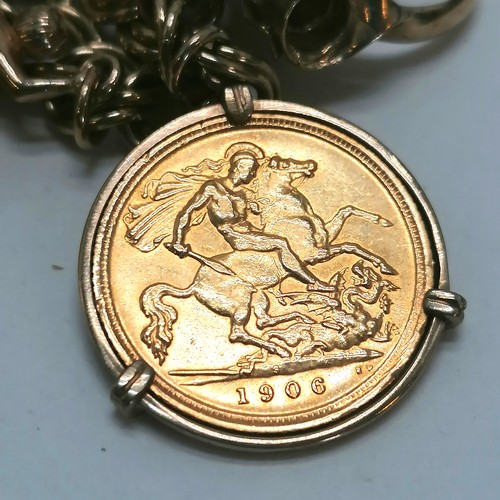 163 - Gold charm bracelet with the following charms 9ct Holy Bible, 1907 King Edward VII sovereign in 9ct ... 