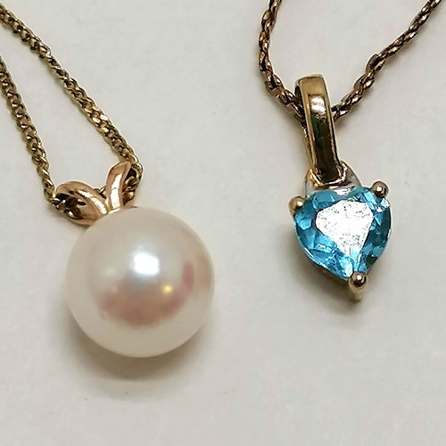 205 - 2 9ct gold pendants on chains, longest length 44cm, one with a pearl drop, other with blue heart sha... 