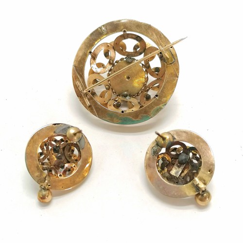 222 - Antique unmarked gold brooch (4cm diameter) and earrings, set with cabochon onyx and cut pearl (pear... 