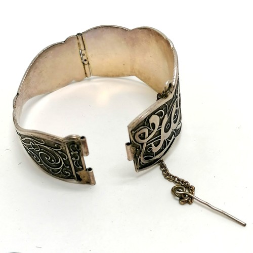 236 - 2 unmarked foreign / middle eastern bangles (1 has old repair) (80g), celtic silver amber brooch, si... 