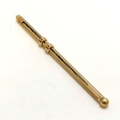 269 - 9ct gold combination swizzle stick / olive pick - extended length 14cm & total weight 5.8g