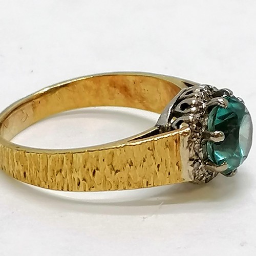 274 - 18ct gold blue zircon & diamond set ring with bark finish shank - size R & 6g total weight