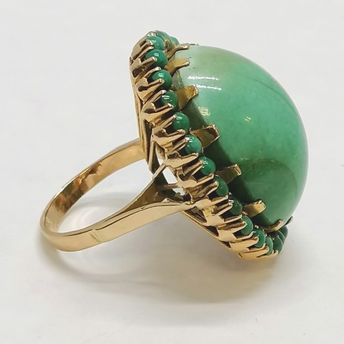 276 - Large tested as 18ct gold turquoise ring - size K½ & 18.9g total weight & 3cm across