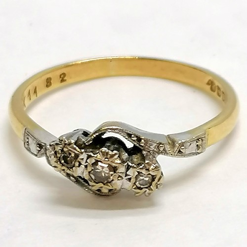 288 - 18ct gold 3 stone illusion set diamond crossover ring - size R½