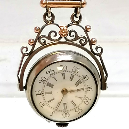 307 - Antique unmarked silver swivel watch with domed crystal to front and back on an unmarked silver and ... 