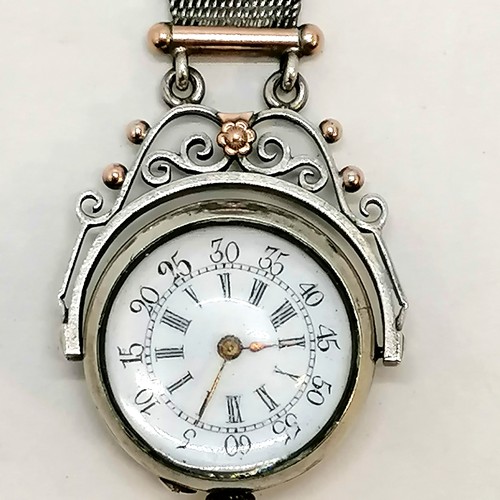 307 - Antique unmarked silver swivel watch with domed crystal to front and back on an unmarked silver and ... 