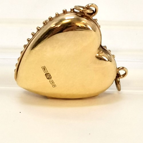 343 - 9ct gold heart stone set Regard locket - total weight 4.5g