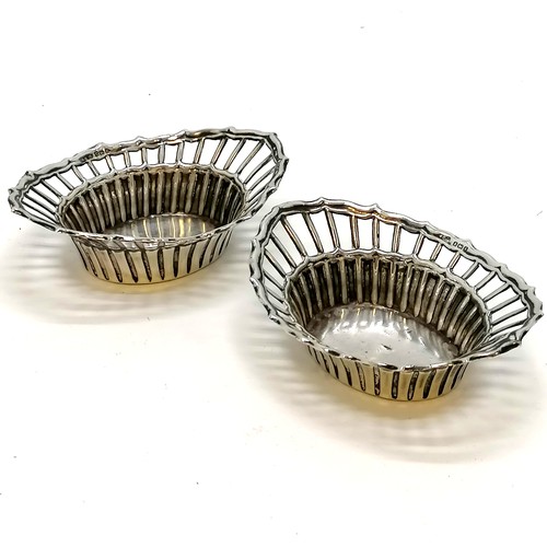 361 - Pair of silver basket design bon-bon dishes 54g, 10.5cm across. some dents to the bases