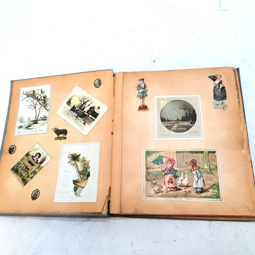 385 - Victorian scrap book containing  42 pages of scraps, 32cm x 27cm, in bright condition but edges of p... 