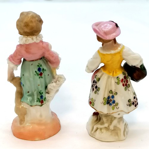 481 - Pair of miniature continental figures - 7.5cm high with slight losses to lace detail to 1 figure