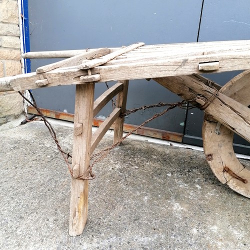 506 - Antique elm pig barrow T/W hay fork