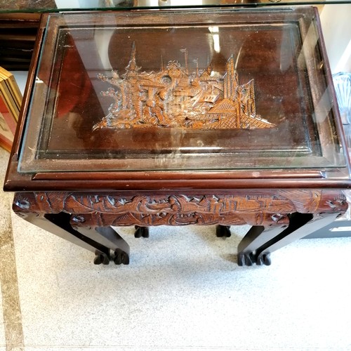 539 - Vintage Oriental carved camphor wood nest of 3 tables with glass tops. Largest 52cm x 36cm x 60cm hi... 