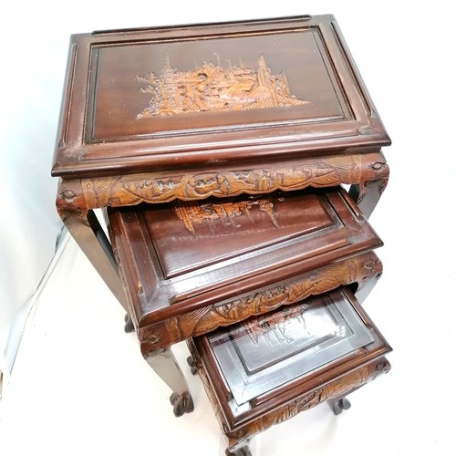 539 - Vintage Oriental carved camphor wood nest of 3 tables with glass tops. Largest 52cm x 36cm x 60cm hi... 