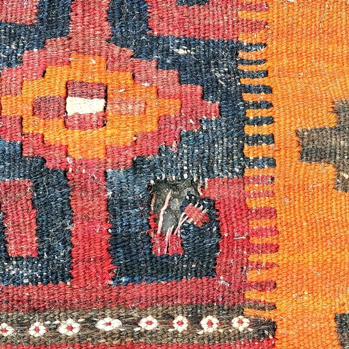 566 - Kilim carpet - orange / blue / green - approx 375cm x 262cm & has some wear holes