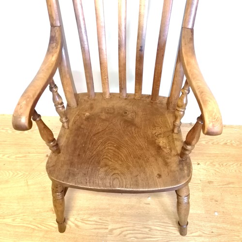 577 - Antique elm and beech slat back farmhouse high back chair. 115cm high x 54cm wide x 44cm deep.In goo... 