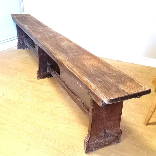 581 - Oak school bench 243cm long x 46cm high x 25 cm wide. T/W 4 part cubby hole both in good used condit... 