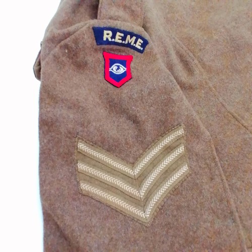 600 - R.E.M.E 2nd WW size 9 uniform jacket with insignia cloth badges. In good condition