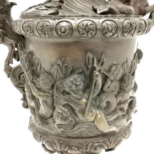 20A - Antique bronze ewer in the style of Benvenuto Cellini profusely decorated with putti at play on a th... 