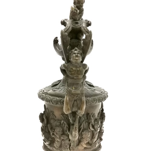 20A - Antique bronze ewer in the style of Benvenuto Cellini profusely decorated with putti at play on a th... 