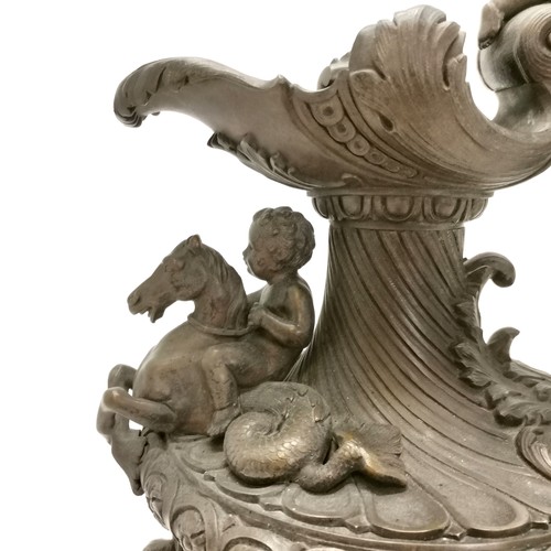 20A - Antique bronze ewer in the style of Benvenuto Cellini profusely decorated with putti at play on a th... 