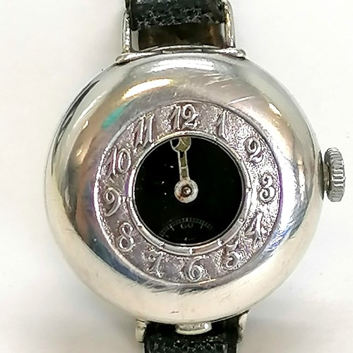 324A - 1st world war silver cased trench wristwatch with black enamel dial and   half hunter style cover wi... 