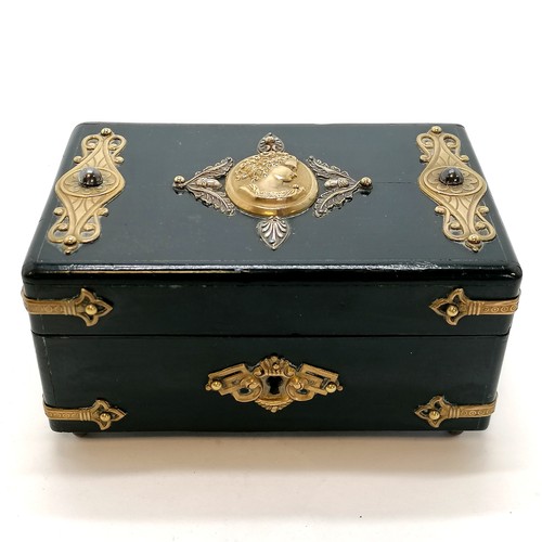 481 - Antique continental ebonised metal mounted jewellery box with a velvet interior on 4 brass feet ~ 14... 