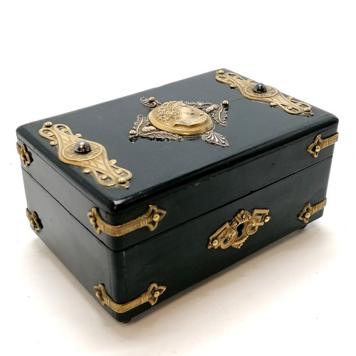 481 - Antique continental ebonised metal mounted jewellery box with a velvet interior on 4 brass feet ~ 14... 