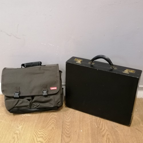 733 - Black leather brief case t/w canvas fishing bag