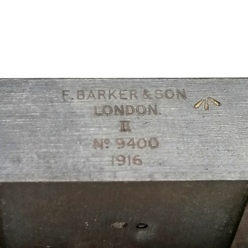 64 - F. Barker & Son London No9400 1916, mahogany cased military instrument, opera glasses t/W a brass ca... 