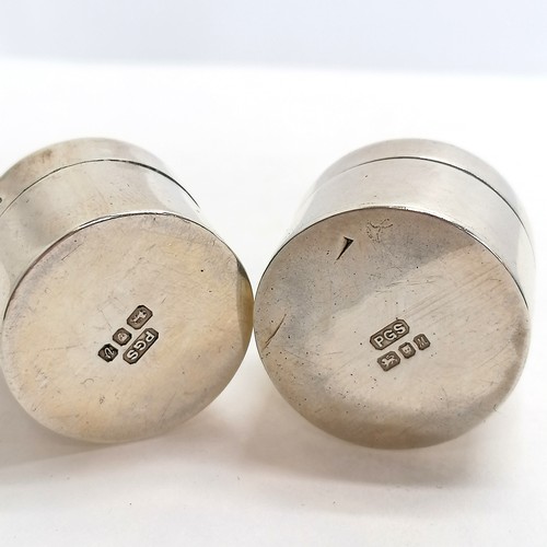 253 - 2 x heavy silver pill boxes - 1 with penguin figure to top (3.8cm high) & the other with a figure co... 