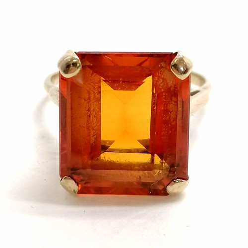 331 - 9ct marked gold ring set with a large orange stone - size S & 7.5g total weight ~ stone slightly loo... 