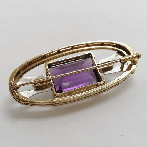 343 - 14ct hallmarked gold Art Deco brooch set with large amethyst & 4 diamonds - 5cm across & 17.6g total... 