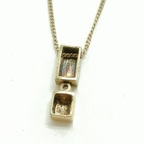 346 - 9ct (375) marked gold pendant set with a diamond on a 9ct gold 40cm chain - 1.1g total weight