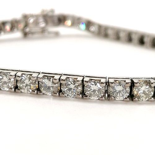 351 - 18ct hallmarked white gold diamond set tennis bracelet - 18cm long & 14g total weight ~ 45 diamonds ... 