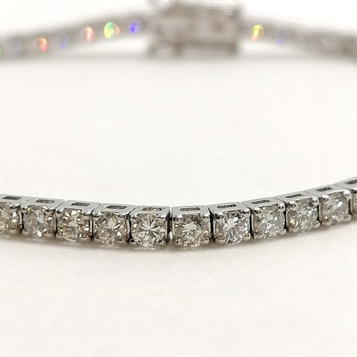 355 - 18ct marked white gold diamond set tennis bracelet - 17.5cm & 8g total weight ~ stones approx 2mm di... 